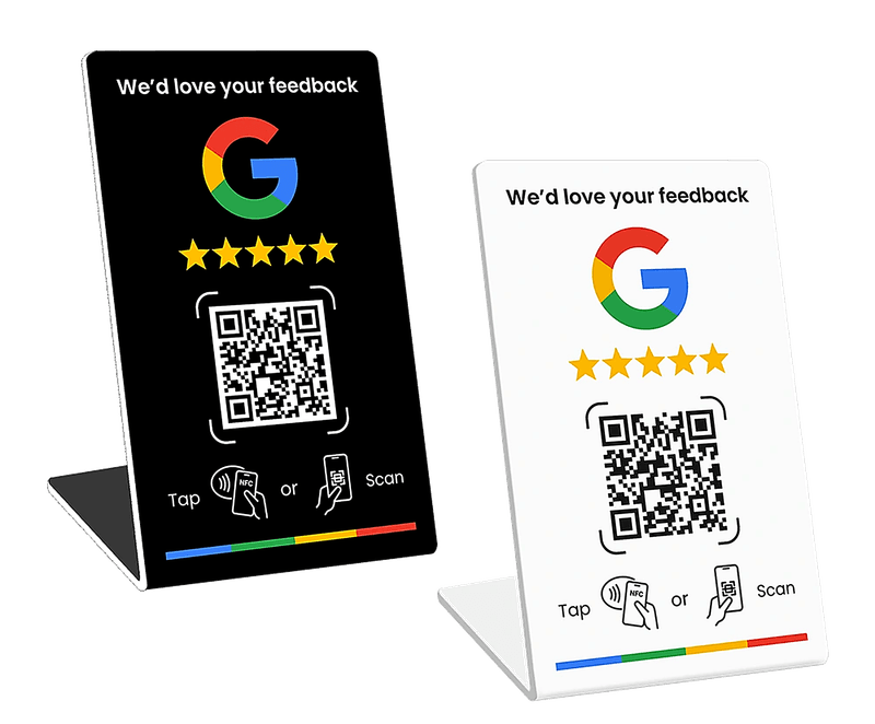 Black and white ScanPraise NFC review cards on display stands, each showing the Google logo, star rating, a QR code, and 'Tap or Scan' instructions